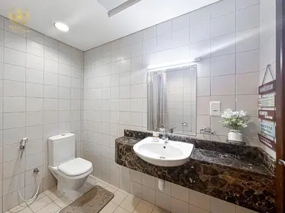 a bathroom with a toilet and a sink at Royalton - Tranquil 15th-Floor Apartment with City Views in Dubai