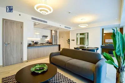 a living room with a couch and a table at Luxury Escapes - ME DO RE Tower JLT in Dubai