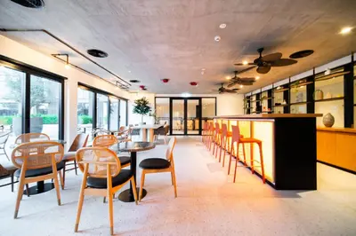 a dining room with a table and chairs at SettlerHomes - Serene Golfville Escape near Parkside in Dubai