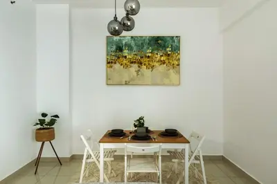 a dining room with a table and chairs at ShoresInn - Elegant 1BR in Dubai Marina in Dubai