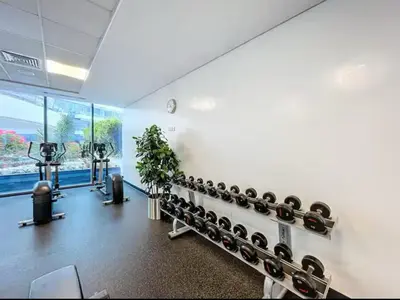 a gym with a bunch of dumbbells on the wall at Luxury Apartment in Dubai Marina w Stunning View in Dubai