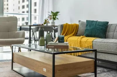 a living room with a couch and a coffee table at ShoresInn - Stylish Space in Dubai Marina in Dubai