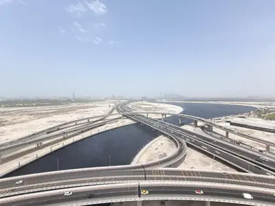 an overhead view of a bridge over a body of water at Quill Residence - Canal View Spacious 3 bedroom Apartment in Dubai