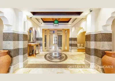 a lobby with a large bowl in the middle of a room at 5 Min Walk to Burj Khalifa 2BHK Luxury Downtown Burj Haven in Dubai