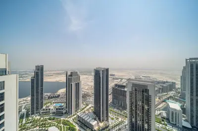 an aerial view of a city with tall buildings at LUXE | Luxury 2BR | Creek View | Modern & Cozy in Dubai
