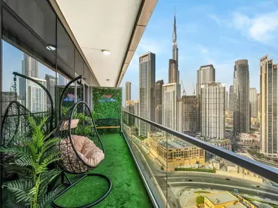 a balcony with a view of the city at 5 Star High Rise Luxury Apartment, Infinity Pool With Stunning Burj View - Brand New Apartment in Dubai