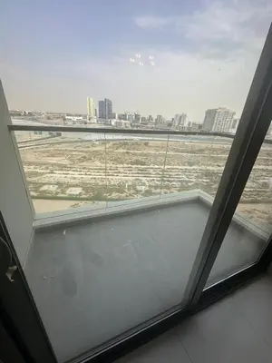 a window in a room with a view of a city at Peaceful Studio Getaway in Liwan in Dubai