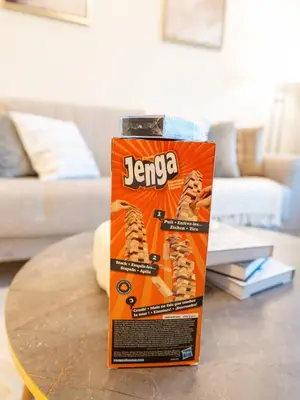 an orange box on a table in a living room at Luxury 1BR, 5 Min walk to Dubai Mall & Burj Khalifa, Can Sleep 1-4 in Dubai