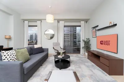 a living room with a couch and a table at GuestReady - Marvellous getaway in Dubai Marina in Dubai