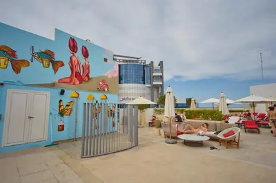 a group of people sitting in chairs on a patio at Hight-floor Studio Atlantis view in Dubai