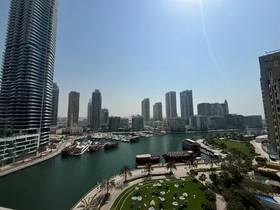 a view of a river in a city with buildings at Sparkle Tower Panoramic Marina View 1BR in Dubai