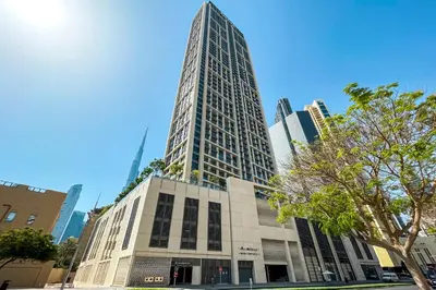 a tall building in the middle of a city at 1BR Burj Royale Near Dubai Mall Downtown in Dubai