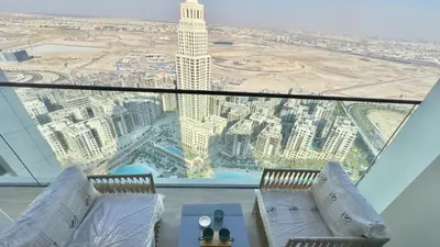 a view of the city from the top of a skyscraper at Luxury 2BR w Waterfront View & Smart Controls by Vibel in Dubai