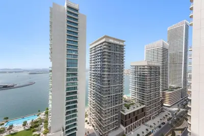 a group of tall buildings next to the water at Silkhaus Marina View 1BDR Private Beach Access in Dubai