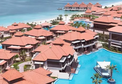 an aerial view of a resort with a swimming pool at Luxury Holiday Home, Spacious 1 bedroom, Burj Alarab full ocean view, located in Anantara the palm, Palm Jumeirah, Dubai in Dubai