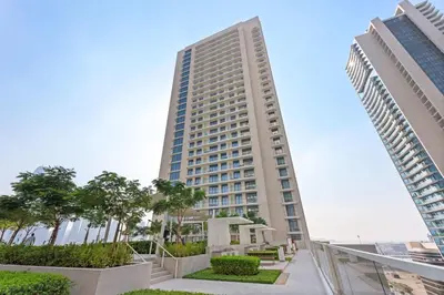 a tall building in the middle of two buildings at Silkhaus Mid Floor Marina Vista with Private Beach in Dubai