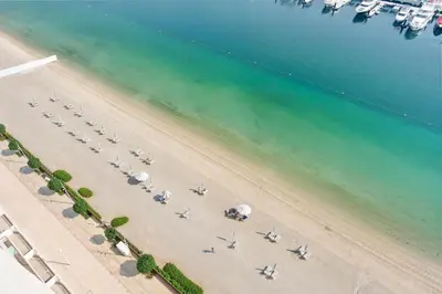 an aerial view of a group of planes on a beach at Silkhaus Mid Floor Marina Vista with Private Beach in Dubai