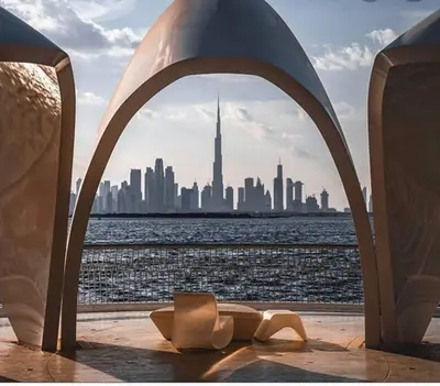 a view of the skyline of a city from the water at Contemporary 1BR condo with pool at Creek Harbour in Dubai
