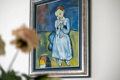 a painting of a girl in a blue dress at 2BR Torch Tower High Floor Dubai Marina in Dubai