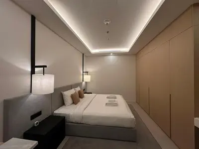 a bedroom with a bed in a room at AWS Holiday Homes - Oasis in the Palm in Dubai