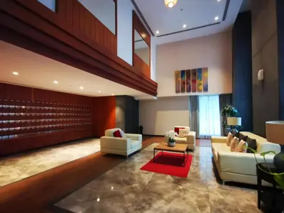 a lobby with two couches and a red rug at Golden homes Residences Tower 05 1BR CITY VIEW Near Dubai mall & burj khalifa in Dubai