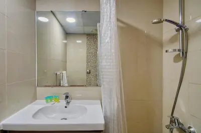 a bathroom with a sink and a shower with a mirror at Aesthetic 2BR with Marina Waterfront View in Dubai