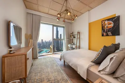 a bedroom with a large bed and a large window at Exclusive front row seats to Burj Khalifa fireworks from penthouse level, downtown Dubai in Dubai