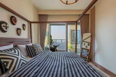 a bedroom with a blue and white bed and a window at Exclusive front row seats to Burj Khalifa fireworks from penthouse level, downtown Dubai in Dubai