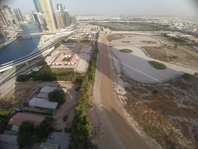 an aerial view of a highway in a city at Al Quoz 2 Bed Budget Apartment in Dubai