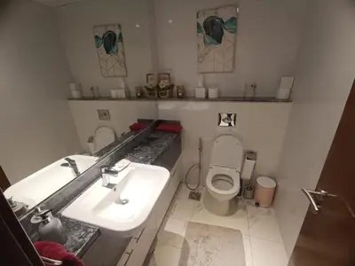 a bathroom with a sink and a toilet at Al Quoz 2 Bed Budget Apartment in Dubai