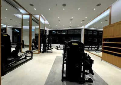 a gym with several treadmills in a building at Premium Stay at The Address Residences JBR in Dubai