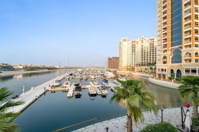 a marina with boats in the water in a city at Silkhaus Beach Accessible Studio Palm View in Dubai