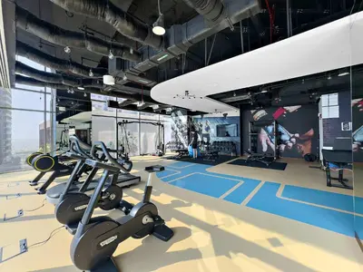 a gym with treadmills and exercise equipment in a building at Silkhaus Modern Dubai Marina 1BDR Marina Gate in Dubai