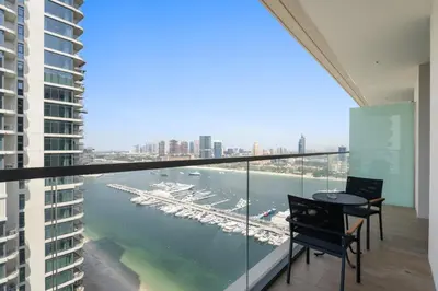 a balcony with a view of a marina at Silkhaus 1BDR with Private Beach Skyline Views in Dubai