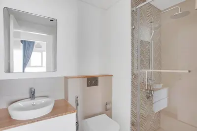 a bathroom with a sink and a toilet and a mirror at Blueground Dubai Hills Estate balcony elev DXB-1120 in Dubai