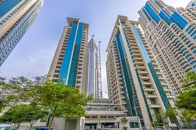 a group of tall buildings in a city at Blueground Boulevard Central pool gym DXB-1179 in Dubai