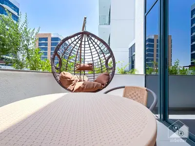 a swing sitting on top of a table at Charming Studio with Balcony in Azizi Riviera in Dubai