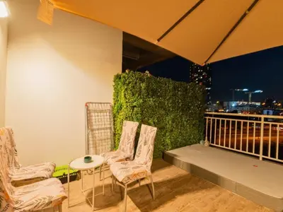 a group of chairs and a table on a balcony at Al Barsha South Fourth in Dubai