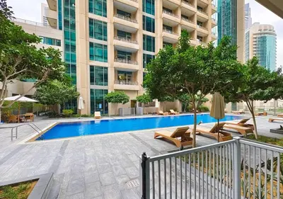 an image of a swimming pool in a building at Burj Khalifa View Downtown Gem, 8 Minutes Walk to Dubai Mall in Dubai