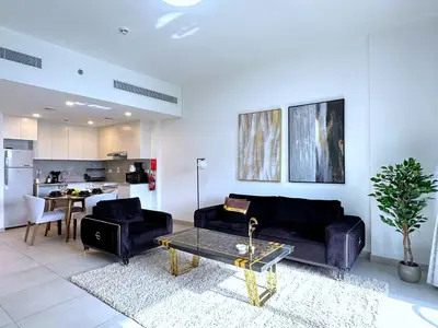 a living room with two couches and a table at MegaLuxury Flat Resort, Amazing Pool, Burj direct View in Dubai