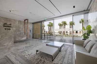 a living room with a couch and a table at Sukoon's Elegant Suite in Dubai