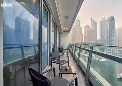 a balcony with chairs and a view of the city at bnbmehomes - Silverene Tower in Dubai