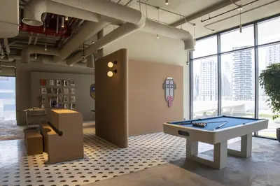 a room with a ping pong table in a building at Modern Studio at Upside Living, Business Bay with Burj Khalifa View in Dubai