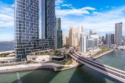 an aerial view of a city with tall buildings at Luxurious 2BR Home with Stunning Marina Skyline View in Dubai