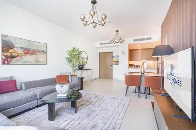a living room with a couch and a table at Luxurious 2BR Home with Stunning Marina Skyline View in Dubai