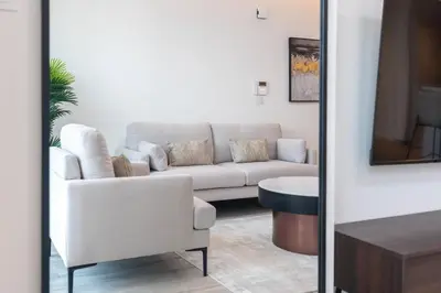 a living room with a couch and a table at 1 Bedroom - Ahad Residence - Business Bay - Dubai in Dubai