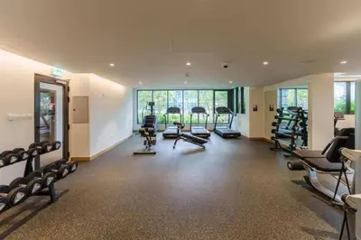 a gym with a lot of treadmills and exercise bikes at 1 Bedroom - Ahad Residence - Business Bay - Dubai in Dubai