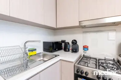 a kitchen with a sink and a stove at Prime location - ACT 1 ACT 2 - Downtown in Dubai