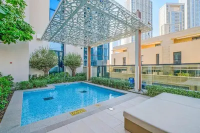 a swimming pool in the middle of a building at Prime location - ACT 1 ACT 2 - Downtown in Dubai
