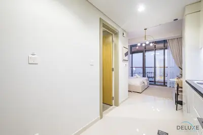 a bathroom with a sink and a toilet in a room at Special Offer Refined Studio with City Views by Deluxe Holiday Homes in Dubai